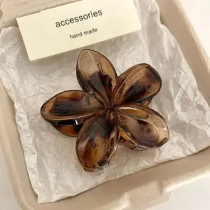 Brown flower claw clip close-up